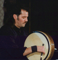 Mance playing bodhran